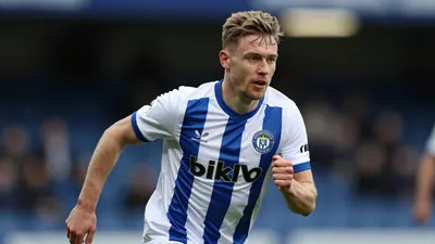 Huddersfield Town's title hopes suffer a setback as they trail leaders Lincoln by 36 points