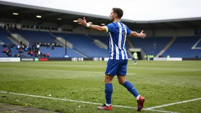Midfielder Archie Collins says Huddersfield Town's goalless draw with ten-man Mansfield Town was a disappointment, but...